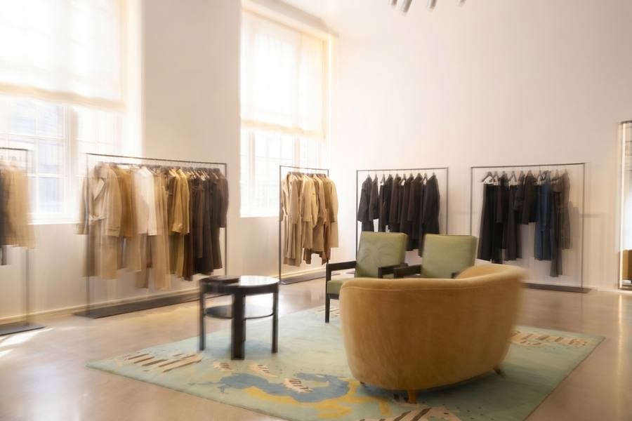 Rails of clothing in a multi-brand store